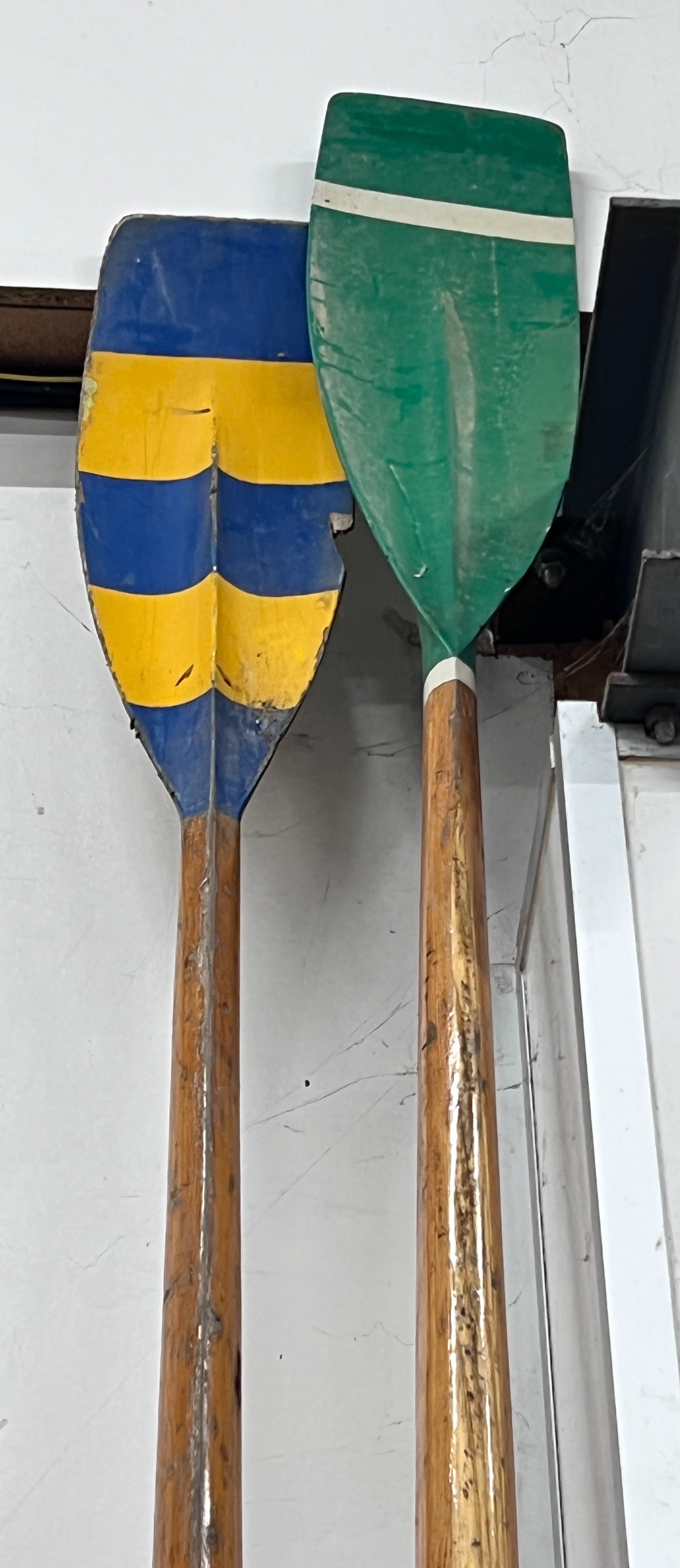 Two vintage wood oars, one by Aylings of Surrey with painted blades, larger length 384cm